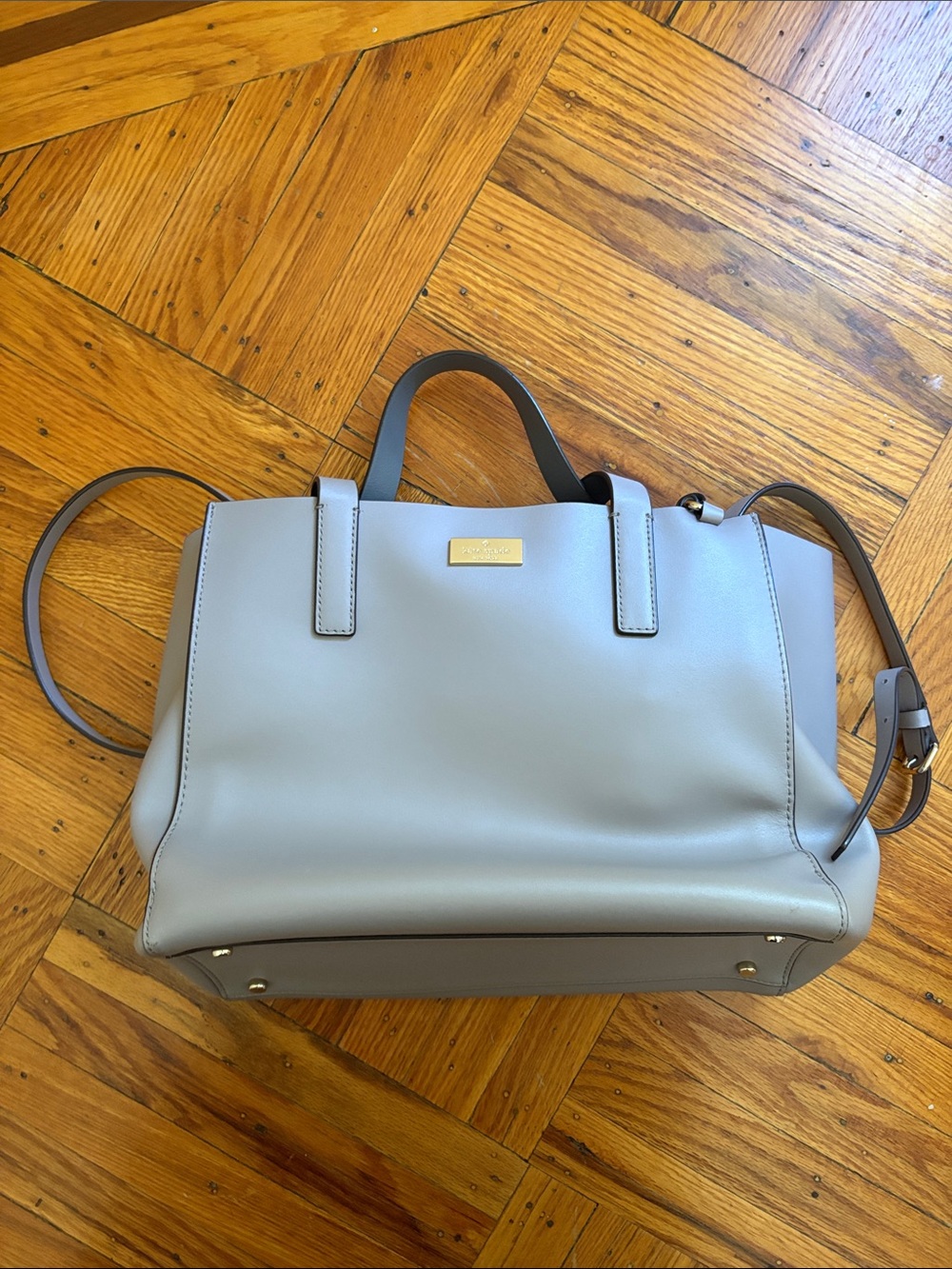 kate spade light gray leather tote with gold plaque